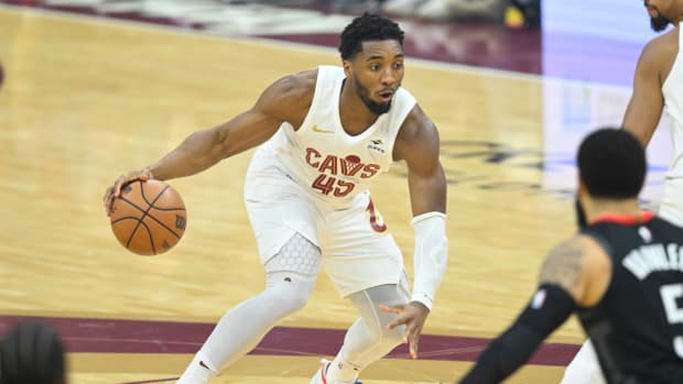 Dec 18, 2023; Cleveland, Ohio, USA; Cleveland Cavaliers guard Donovan Mitchell (45) dribbles the ball in the first quarter against the Houston Rockets at Rocket Mortgage FieldHouse.